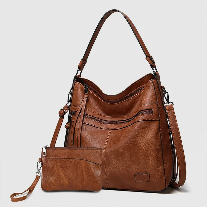 Designer schoudertassen voor dames - Grote leren schoudertassen voor op reis en weekendjes weg.